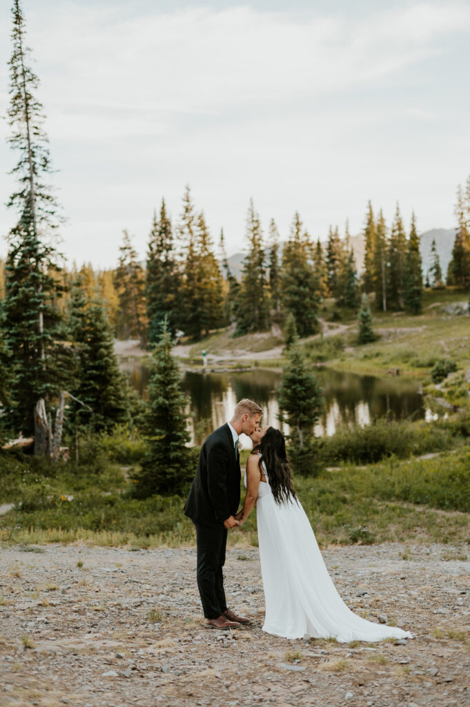 Couple kissing after their elopement ceremony at Lake Irwin, Crested Butte. 
