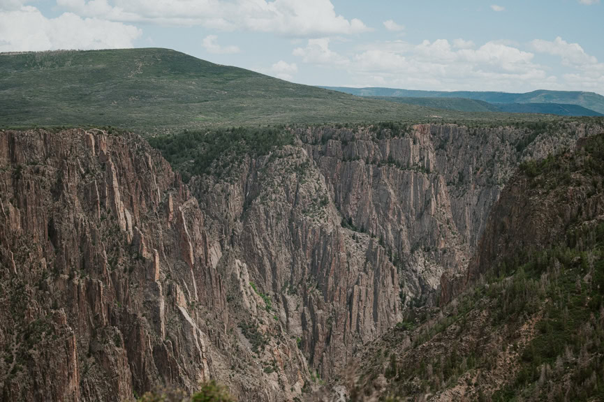A vast view of canyons and cliffs as seen from Pulpit Rock Overlook in Black Canyon of the Gunnison National Park.