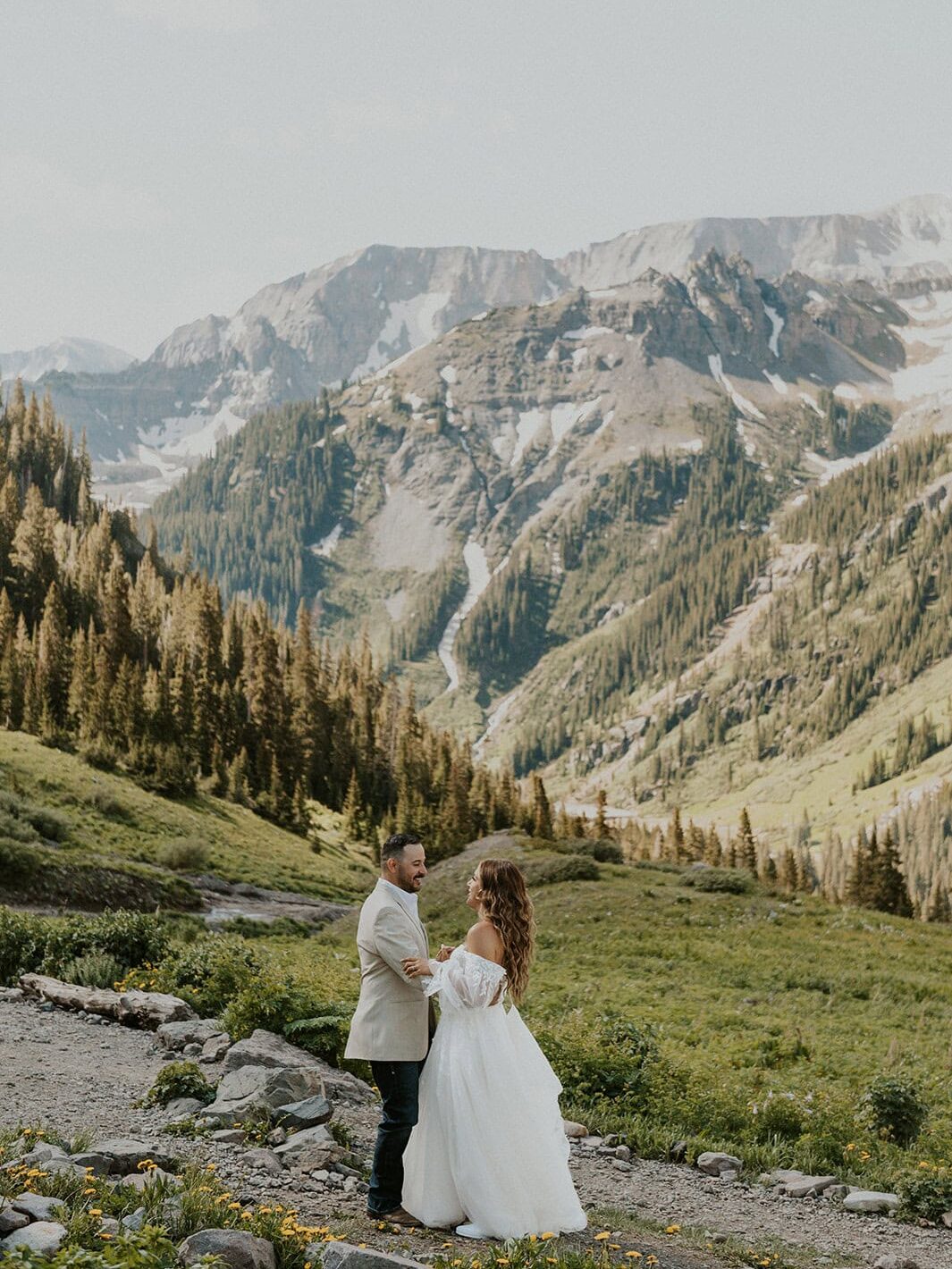 Couple sharing their first dance beneath the mountains of Yankee Boy Basin during their San Juan Mountains elopement.