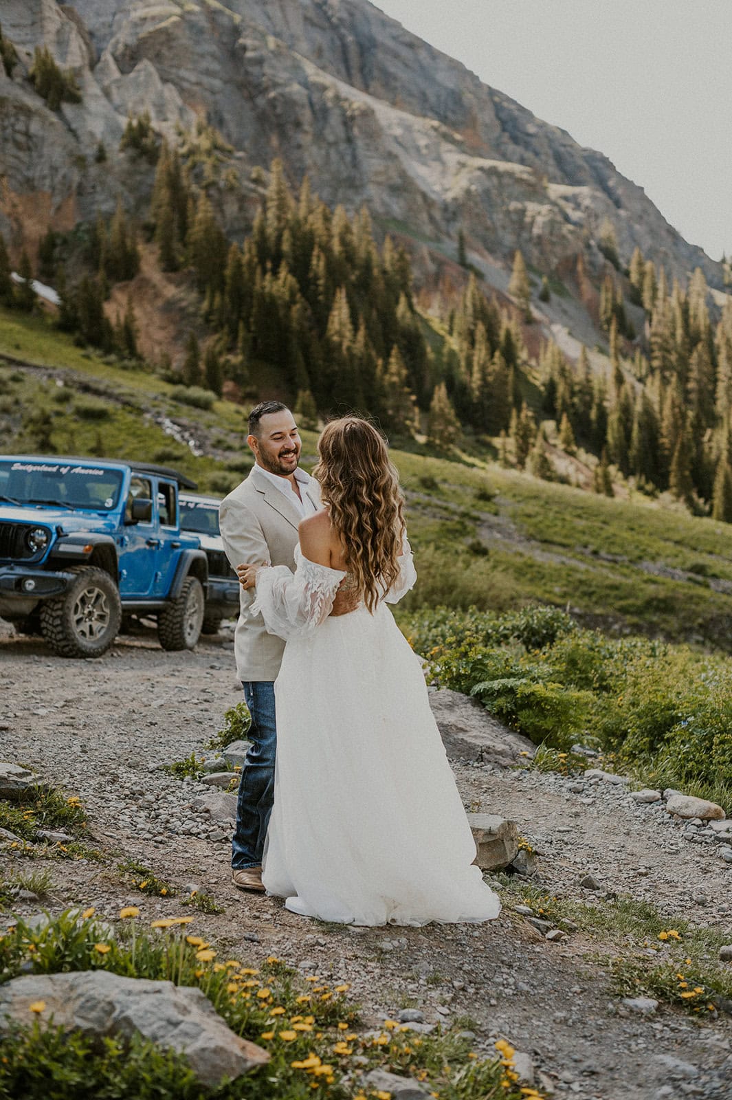 Couple eloping in the San Juan Mountains having their first dance after off-roading.